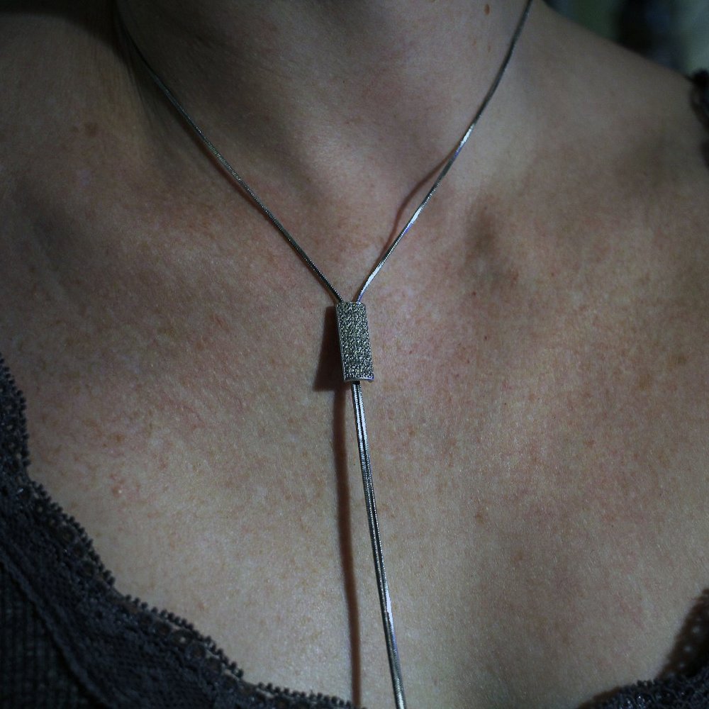 Silver lariat with bolo rhinestone clasp